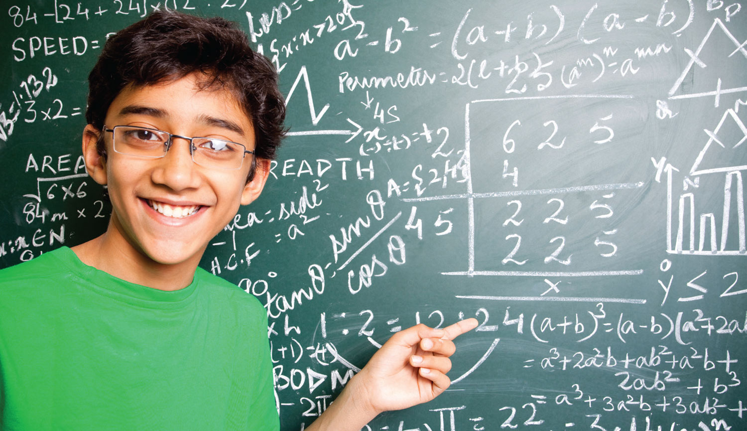 student pointing at blackboard with math formulas